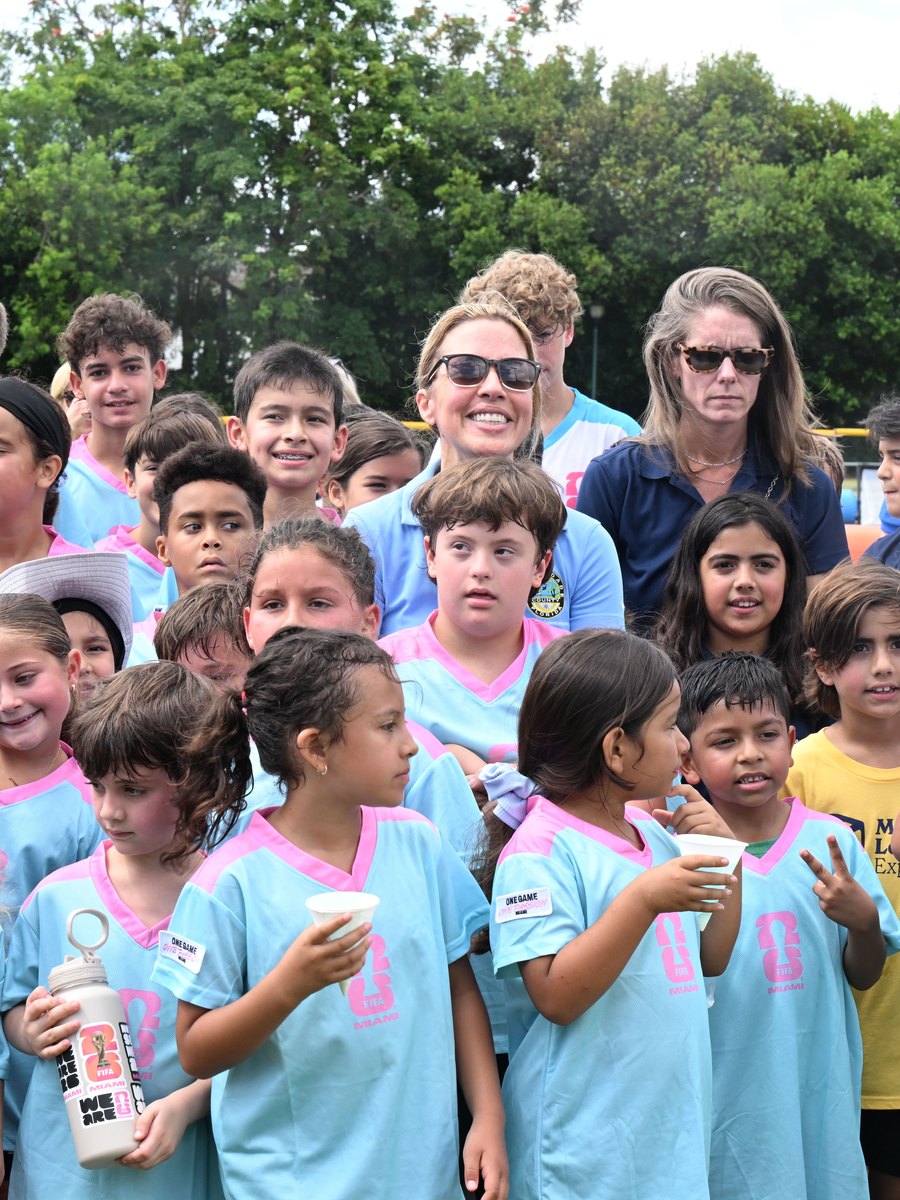 Commissioner Raquel Regalado with kids from a District 7 youth soccer program
